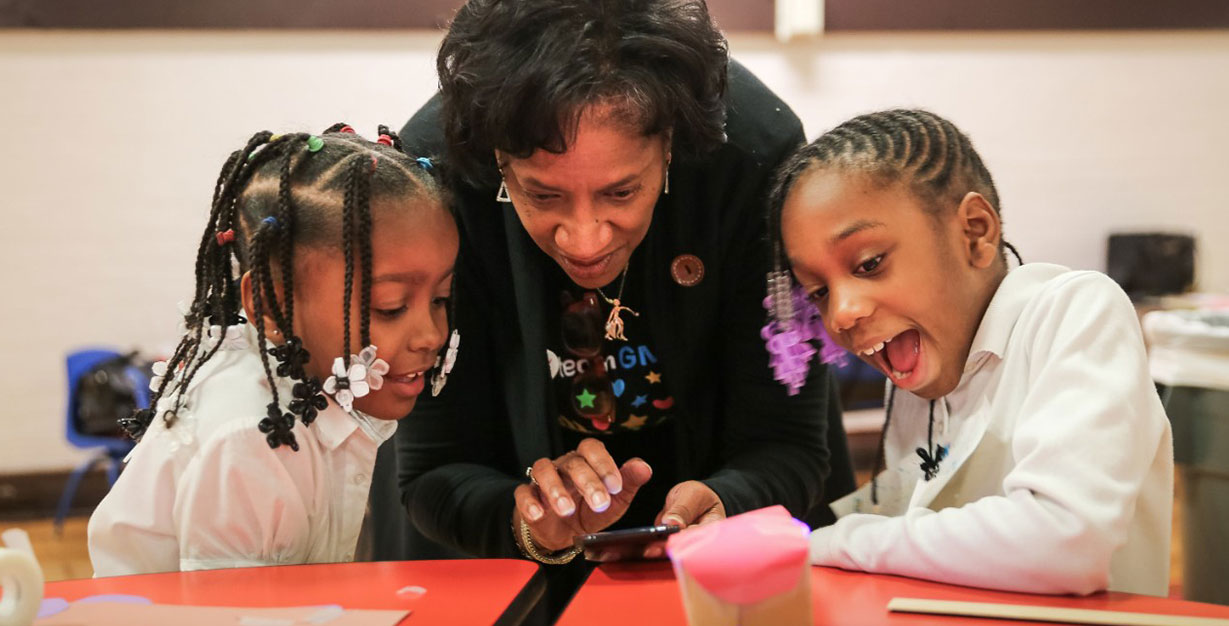 STEM Teacher Teaching Young Students About Science, Technology, Engineering and Math
